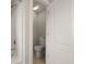 Enclosed toilet room next to a bath/shower with a white tile surround and bright lighting at 4143 Rigsby Ln, Charleston, SC 29414
