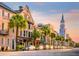 Charming street view featuring historic architecture, palm trees, and a picturesque church steeple at sunset at 4163 Rising Tide Dr, Summerville, SC 29485