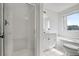 Bright bathroom featuring a glass shower, white vanity, large tub, and a window at 4735 Arco Ln, North Charleston, SC 29418