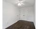Bright bedroom with white walls, ceiling fan, dark wood floors, and closet at 4735 Arco Ln, North Charleston, SC 29418
