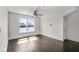 Bright bedroom features hardwood floors, a ceiling fan, and a large window with picturesque water views at 4735 Arco Ln, North Charleston, SC 29418
