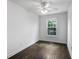 Bright bedroom with white walls, dark wood floors, large window with view at 4735 Arco Ln, North Charleston, SC 29418