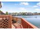 Relaxing deck view overlooking the serene water and surrounding townhouses, providing a peaceful outdoor living space at 4735 Arco Ln, North Charleston, SC 29418