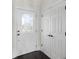 Bright entryway features a white front door with decorative glass and adjacent closet for ample storage at 4735 Arco Ln, North Charleston, SC 29418