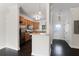 Bright kitchen features stainless steel appliances and wood cabinets, seamlessly connecting to the entryway at 4735 Arco Ln, North Charleston, SC 29418