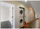 Conveniently located laundry area featuring a stacked washer and dryer, maximizing space on the upper level at 4735 Arco Ln, North Charleston, SC 29418
