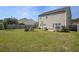 Large backyard with lush grass, featuring a deck and patio at 500 Dolphin Dr, Summerville, SC 29485