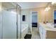 The main bath features a vanity with double sinks, a walk-in shower, and a bathtub at 500 Dolphin Dr, Summerville, SC 29485