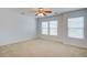 Spacious bedroom featuring neutral carpet, ceiling fan, and bright natural light at 500 Dolphin Dr, Summerville, SC 29485