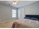 Cozy bedroom with a large bed, window, and double door closet at 500 Dolphin Dr, Summerville, SC 29485
