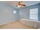 Light-filled bedroom with a bed, ceiling fan, and carpet flooring at 500 Dolphin Dr, Summerville, SC 29485
