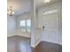 Welcoming entryway with a chandelier and hardwood floors at 500 Dolphin Dr, Summerville, SC 29485