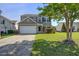 Charming two-story home with a well-maintained lawn and a two-car garage at 500 Dolphin Dr, Summerville, SC 29485