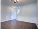 Bright, open-concept living room features dark hardwood floors and neutral walls at 500 Dolphin Dr, Summerville, SC 29485