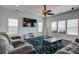 Spacious living room featuring modern furniture, a ceiling fan and lots of natural light at 500 Dolphin Dr, Summerville, SC 29485