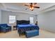 Large main bedroom featuring tray ceilings, a ceiling fan, and a large bed at 500 Dolphin Dr, Summerville, SC 29485