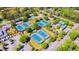 An aerial view of multiple tennis courts surrounded by lush greenery and trees at 5024 Scow Ct, Summerville, SC 29485