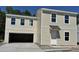 Two-story home with a two-car garage, and yard under construction at 5024 Scow Ct, Summerville, SC 29485