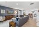 Open-concept living room leading to a kitchen with modern decor and hardwood floors at 5024 Scow Ct, Summerville, SC 29485