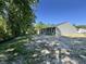 Gray-sided single-Gathering home with a small patio, set in a natural, partially wooded lot at 5031 Scow Ct, Summerville, SC 29485