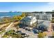 Coastal view featuring homes, restaurants, and waterfront with parking, landscaping, and streetscape at 508 Helmsman St, Charleston, SC 29492