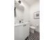 Modern powder room featuring geometric tile flooring and a sleek vanity at 508 Helmsman St, Charleston, SC 29492