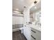 The well-lit bathroom features a shower/tub combo and modern black fixtures with a white vanity at 508 Helmsman St, Charleston, SC 29492