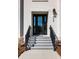 Stylish front entrance features a modern door with sidelights, stone steps, and manicured landscaping at 508 Helmsman St, Charleston, SC 29492