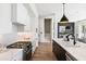 Modern kitchen with stainless steel appliances, white cabinets, and a view into the dining area at 508 Helmsman St, Charleston, SC 29492