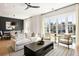 Bright living room with modern furnishings, large windows, and hardwood floors at 508 Helmsman St, Charleston, SC 29492