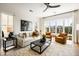 Bright living room with modern furnishings, a large window, and hardwood floors at 508 Helmsman St, Charleston, SC 29492