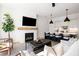 Open-concept living area featuring a fireplace, modern kitchen, and stylish furniture at 508 Helmsman St, Charleston, SC 29492