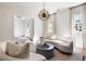 Airy living room with sleek furniture, modern chandelier, and views into the adjacent room at 508 Helmsman St, Charleston, SC 29492