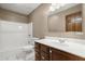 Bathroom with a white tub and shower combo, vanity, and tiled floor at 520 Givhans Rd, Ridgeville, SC 29472