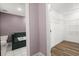 Bathroom with Jacuzzi tub, walk-in closet, and tile floors at 520 Givhans Rd, Ridgeville, SC 29472