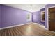 Spacious bedroom with hardwood floors, a window, and a door at 520 Givhans Rd, Ridgeville, SC 29472