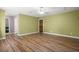 Bedroom with wood floors and doors to bathroom and closet at 520 Givhans Rd, Ridgeville, SC 29472