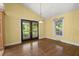 A dining room with glass panel doors that open to the backyard at 520 Givhans Rd, Ridgeville, SC 29472