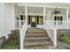 Inviting front porch with classic details, creating a welcoming entrance to the home at 520 Givhans Rd, Ridgeville, SC 29472