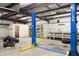 Mechanic garage interior with a two-post lift and plenty of space to work at 520 Givhans Rd, Ridgeville, SC 29472