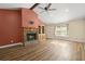 A living room featuring a brick fireplace and wood floors at 520 Givhans Rd, Ridgeville, SC 29472