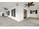 Large covered porch featuring multiple windows and ceiling fans at 520 Givhans Rd, Ridgeville, SC 29472