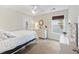Comfortable bedroom with white furniture and soft natural light at 521 Sanders Farm Ln, Wando, SC 29492