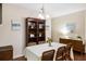 Stylish dining room with hardwood floors, a classic hutch, elegant decor, and a table with seating for six at 521 Sanders Farm Ln, Wando, SC 29492
