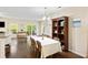 Open-concept living space with dining area and living room area, a sliding glass door, and hardwood floors at 521 Sanders Farm Ln, Wando, SC 29492