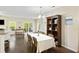 Open-concept living space with dining area and living room area, a sliding glass door, and hardwood floors at 521 Sanders Farm Ln, Wando, SC 29492