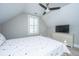 Well-lit bedroom boasts a cozy patterned bedspread, window shutters, modern ceiling fan, and a TV at 521 Yellow Tower Ter, Charleston, SC 29412