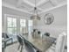 Dining area featuring modern chandelier, wainscoting, and natural light at 521 Yellow Tower Ter, Charleston, SC 29412