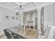 Dining area featuring a modern chandelier, wainscoting, and stylish decor at 521 Yellow Tower Ter, Charleston, SC 29412