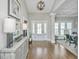 Elegant foyer with hardwood floors, wainscoting, and natural light at 521 Yellow Tower Ter, Charleston, SC 29412